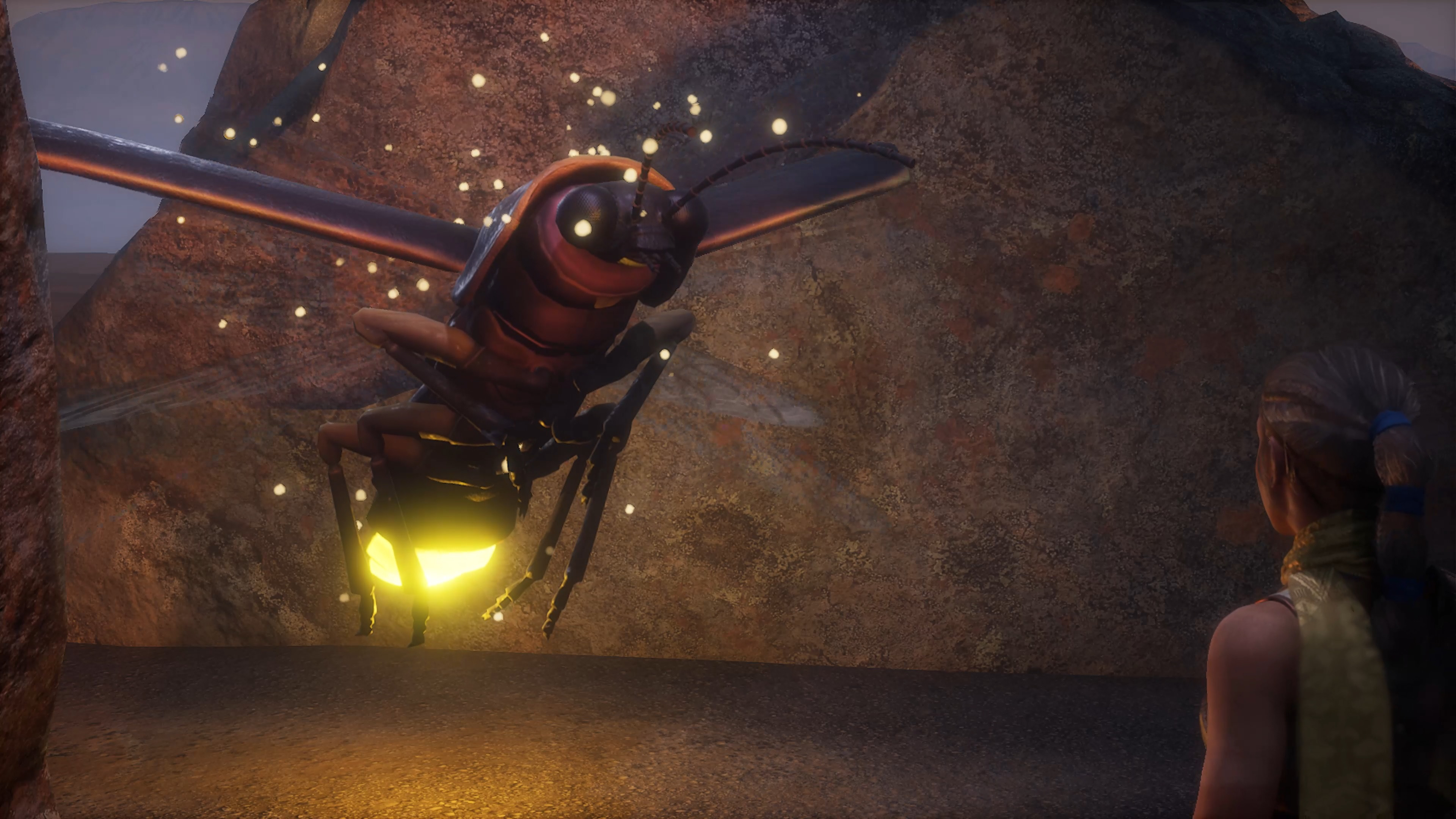 Still from Cause and Effect: a giant firefly hovers against a red rock wall with its wings spread and its abdomen glowing yellow, sparks of light around it, while the explorer watches from the right edge of the frame